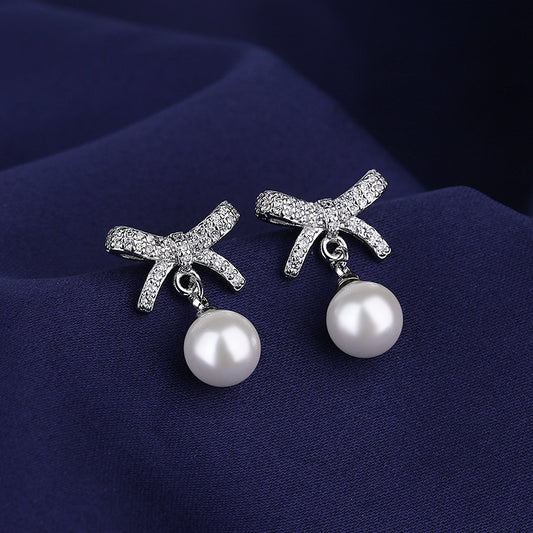 Copper pearl bow tie earrings MYA001ES049